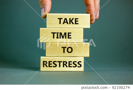 Take time to restress symbol. Concept words Take time to restress on wooden blocks. Beautiful grey table grey background. Psychological business and take time to restress concept. Copy space. 92198274