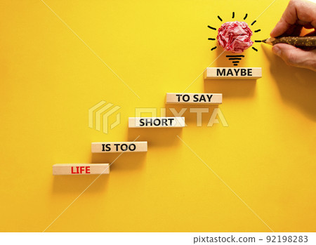 Life is short for maybe symbol. Concept words Life is too short to say maybe on wooden blocks on a beautiful yellow table yellow background. Businessman hand. Business motivational life maybe concept. Life is short for maybe symbol. Concept words Life is too short to say maybe on wooden blocks on a beautiful yellow table yellow background. Businessman hand. Business motivational life maybe concept. 92198283