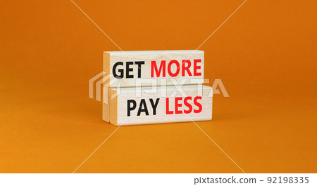 Get more pay less symbol. Concept words Get more pay less on wooden blocks on a beautiful orange table orange background. Business Get more pay less concept. Copy space. Get more pay less symbol. Concept words Get more pay less on wooden blocks on a beautiful orange table orange background. Business Get more pay less concept. Copy space. 92198335