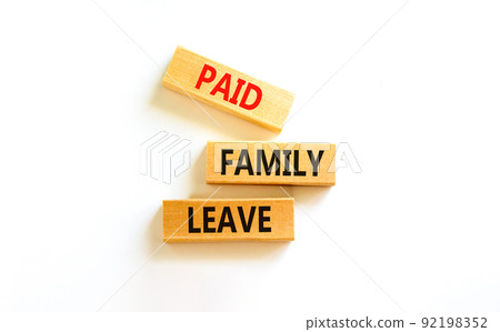 Paid family leave symbol. Concept words Paid family leave on wooden blocks. Beautiful white table white background. Business medical and paid family leave concept. Copy space. 92198352