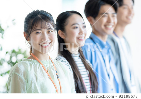 Business casual young men and women Business casual young men and women 92199675