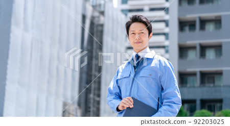Business image Men in work clothes Construction site 92203025