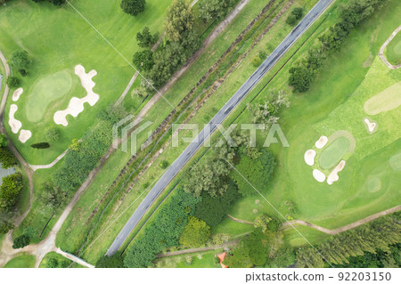 Aerial view drone shot of beautiful golf field High angle view Aerial view drone shot of beautiful golf field High angle view 92203150