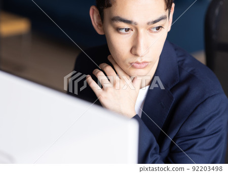 Businessman doing desk work 92203498