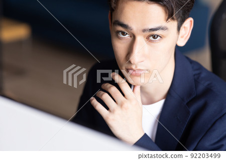Businessman doing desk work Businessman doing desk work 92203499