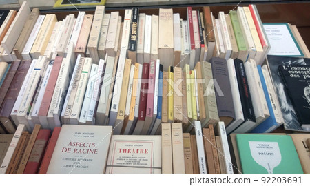 Rows of old unique books in french being sold in the streets of Paris 92203691