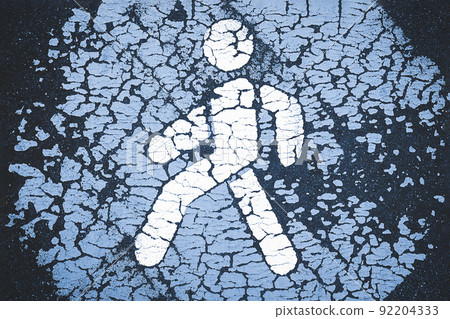 Pedestrian icon or sign on gray footpath background 92204333