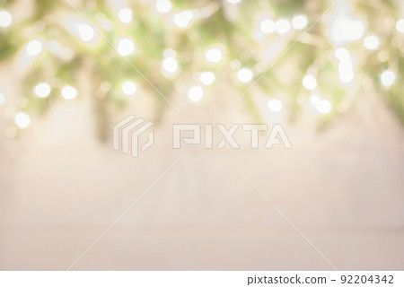 christmas tree frame with spruce twigs decorated with garland lights, blurry holiday background 92204342