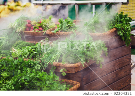humidification of greens and vegetables in grocery store 92204351