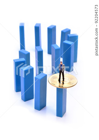 Miniature people figure businessman standing on bitcoin coin Miniature people figure businessman standing on bitcoin coin 92204573