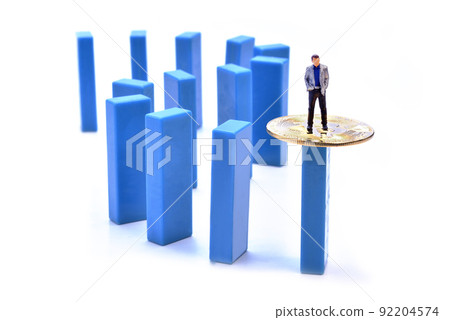 Miniature people figure businessman standing on bitcoin coin Miniature people figure businessman standing on bitcoin coin 92204574