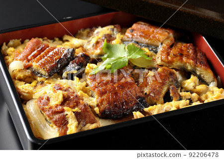 Photographed eel broiled with eggs and trefoil on a black background 92206478