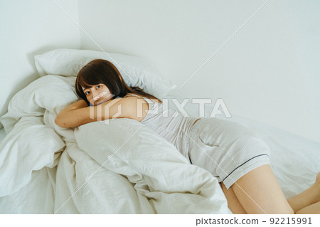 Young woman relaxing and lying down 92215991