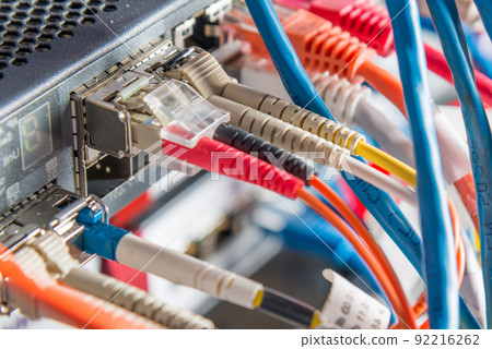 Detail of server with patch cables plugged in ethernet ports 92216262
