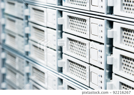 Row of hard drives serving as data storage inside server room 92216267