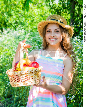 Eat healthy. Cute girl child with basket fruits nature background Eat healthy. Cute girl child with basket fruits nature background 92222364