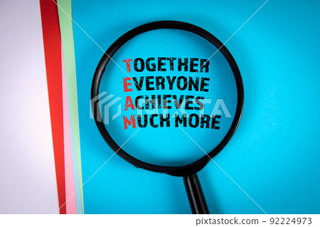 TEAM concept. Magnifying glass on a blue background 92224973