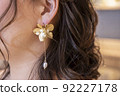 Close-up of the bride's earrings coming up for the wedding 92227178