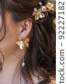 Close-up of the bride's earrings coming up for the wedding 92227182