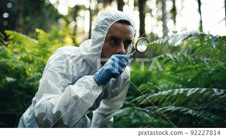 Botanist takes a plant sample for analysis in the mountains 92227814