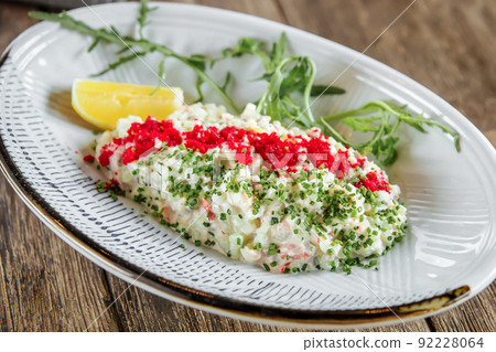 Salad with caviar and crab sticks with wine Salad with caviar and crab sticks with wine 92228064