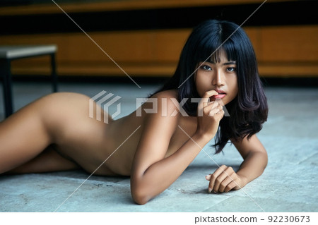 Sexy asian naked seductive girl lay on the floor 92230673