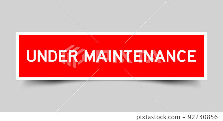 Red color square shape sticker label with word under maintenance on gray background Red color square shape sticker label with word under maintenance on gray background 92230856