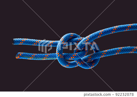 durable colored rope for climbing equipment. knot of braided cable. item for tourism and travel 92232078