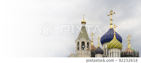 Russian Christian Orthodox church with domes and a cross against the sky. Russian Orthodoxy and Christian Faith concept. 92232618