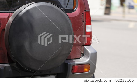 Spare wheel of a car in a case close-up Spare wheel of a car in a case close-up 92233100