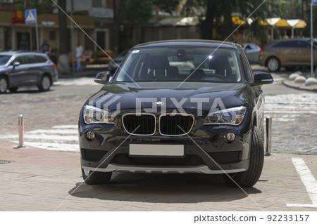 BMW car on city street, close-up BMW car on city street, close-up 92233157