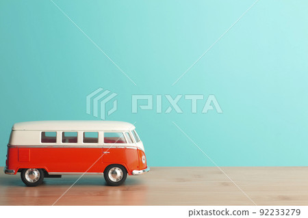 Car travel concept background. Toy retro car on an empty blue background. Car travel concept background. Toy retro car on an empty blue background. 92233279