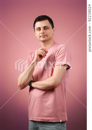 handsome man in t-shirt looking at the camera handsome man in t-shirt looking at the camera 92238024