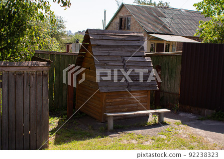 old wooden well in the village 92238323
