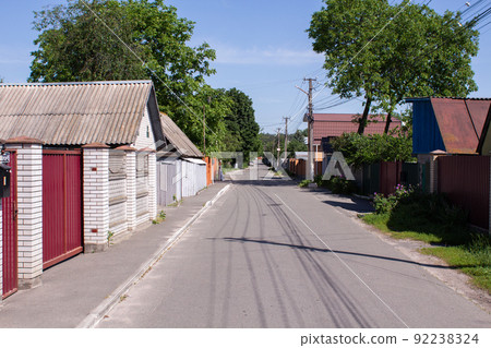 street in the village in summer with a blue sky 92238324