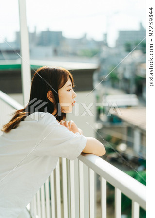 Woman looking at the town Woman looking at the town 92239844