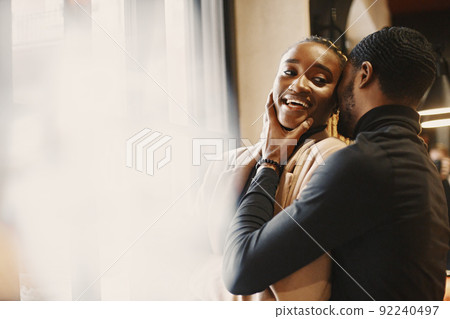Two young people in cafe. African couple enjoying the time spending with each other. Two young people in cafe. African couple enjoying the time spending with each other. 92240497