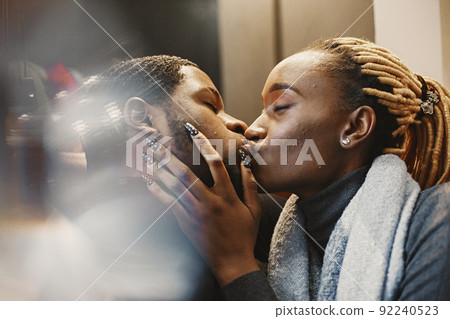 Two young people in cafe. African couple enjoying the time spending with each other. Two young people in cafe. African couple enjoying the time spending with each other. 92240523