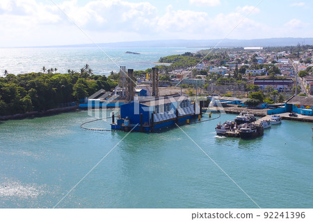 Ships, boats, containers, Puerto Plata harbor, port and cityscape of the industrial zone, Dominican Republic 92241396