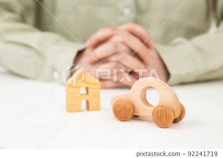 Car and house model and middle woman 92241719