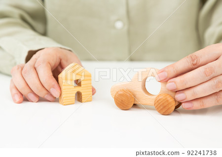 Car and house model and middle woman 92241738