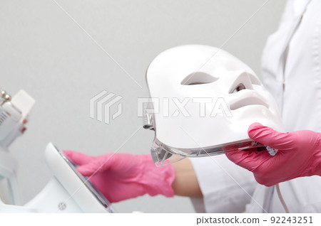 photon mask. Health and beauty. Cosmetic procedure for woman face. Beauty laboratory. LED Facial Mask, Photon Therapy photon mask. Health and beauty. Cosmetic procedure for woman face. Beauty laboratory. LED Facial Mask, Photon Therapy 92243251