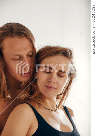 husband holding belly of his pregnant wife. Pregnant woman and loving handsome man hugging tummy at home. Loving Couple. Parenthood concept. Baby Shower. husband holding belly of his pregnant wife. Pregnant woman and loving handsome man hugging tummy at home. Loving Couple. Parenthood concept. Baby Shower. 92243258