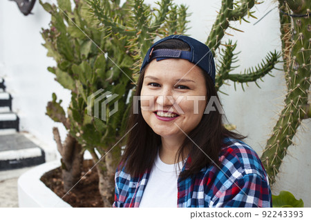 yound pretty american woman siting smiling among cactuses, lifestyle people concept close up yound pretty american woman siting smiling among cactuses, lifestyle people concept close up 92243393