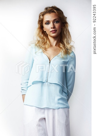 young pretty stylish blond girl posing emotional isolated on white background happy smiling cool smile, lifestyle people concept close up young pretty stylish blond girl posing emotional isolated on white background happy smiling cool smile, lifestyle people concept close up 92243395