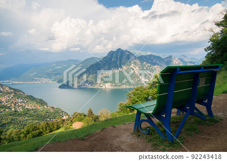 Green and blue big Bench and Iseo lake 92243418
