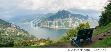 Iseo lake and Green and blue big Bench 92243419