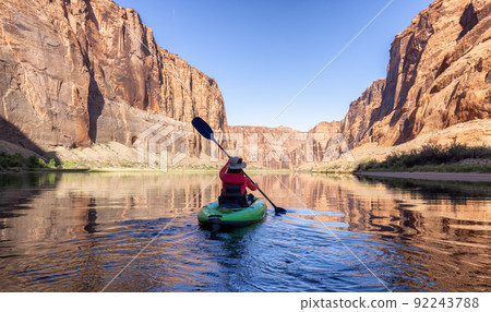 Adventurous Woman on a Kayak paddling in Colorado River. Glen Canyon, Arizona 92243788