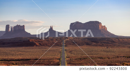 Scenic Road in the Dry Desert with Red Rocky Mountains in Background. Scenic Road in the Dry Desert with Red Rocky Mountains in Background. 92243808
