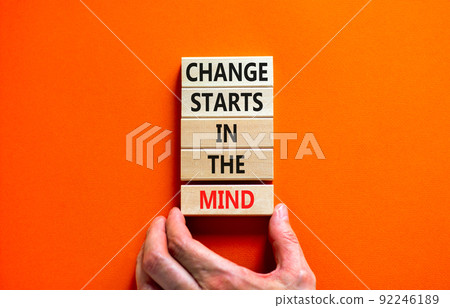 Change starts in the mind symbol. Concept words Change starts in the mind on wooden blocks on a beautiful orange table orange background. Business motivational and change starts in the mind concept. 92246189